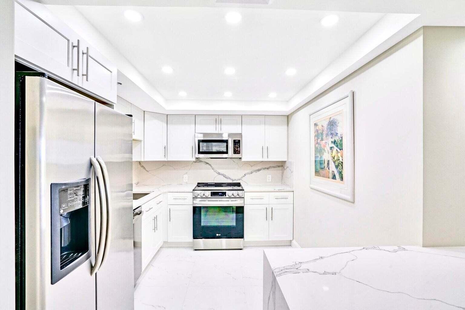 4101 North Ocean Boulevard, Unit D408 Boca Raton, FL 33431 - Photo 3 of 31 OPEN QUARTZ KITCHEN