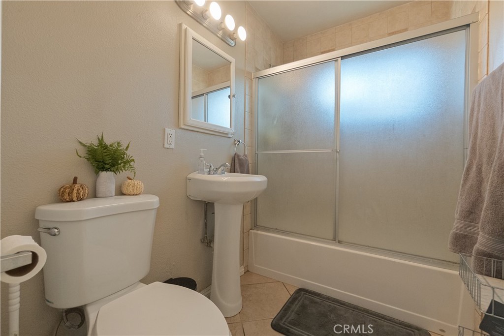 1083 Lorraine Place Rialto, CA 92376 - Photo 12 of 20 a bathroom with a sink toilet and shower