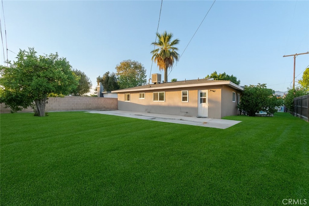 1083 Lorraine Place Rialto, CA 92376 - Photo 19 of 20 a view of house with backyard and swimming pool