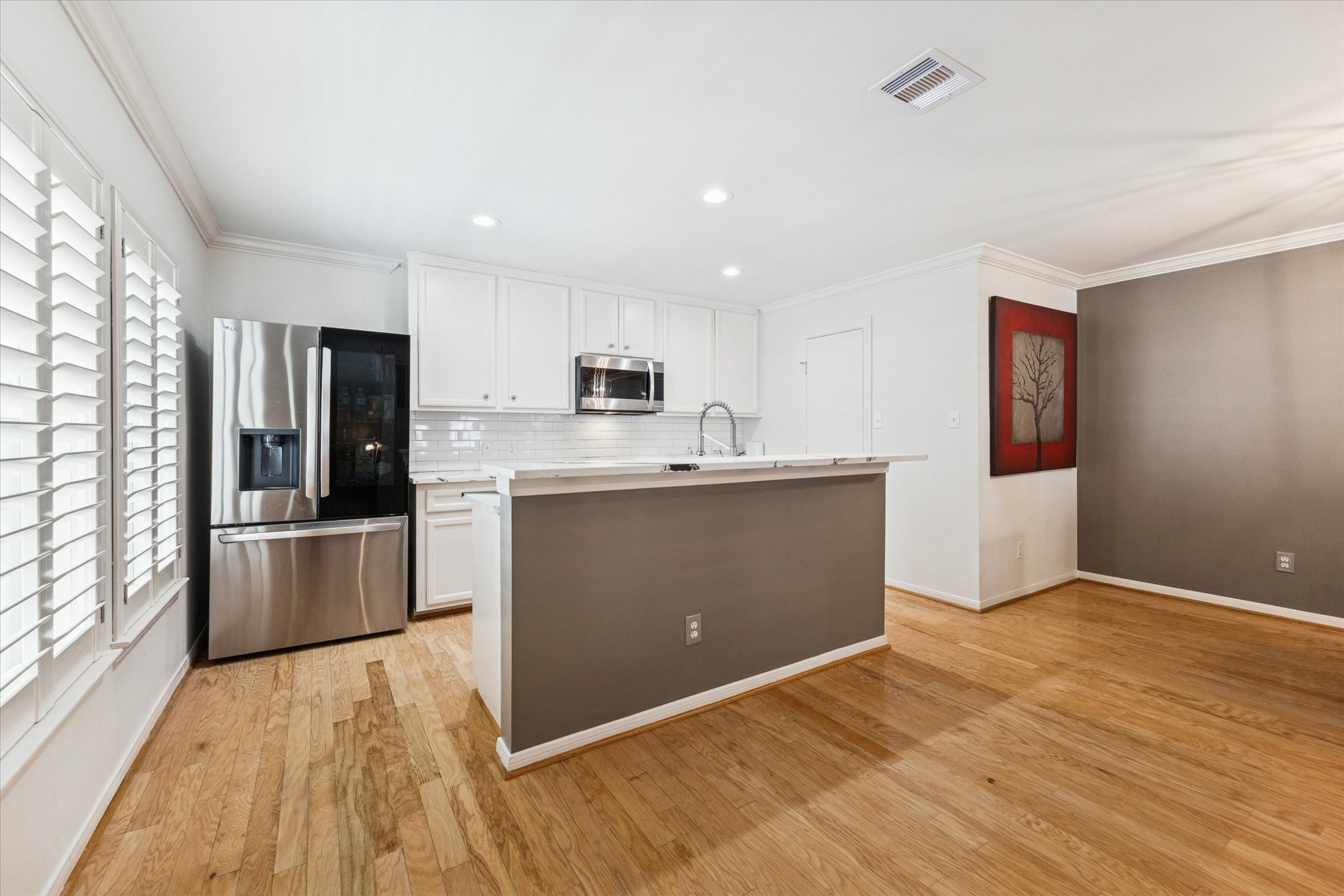 1259 West 17th Street Houston, TX 77008 - Photo 11 of 22 a kitchen with a refrigerator and a stove top oven