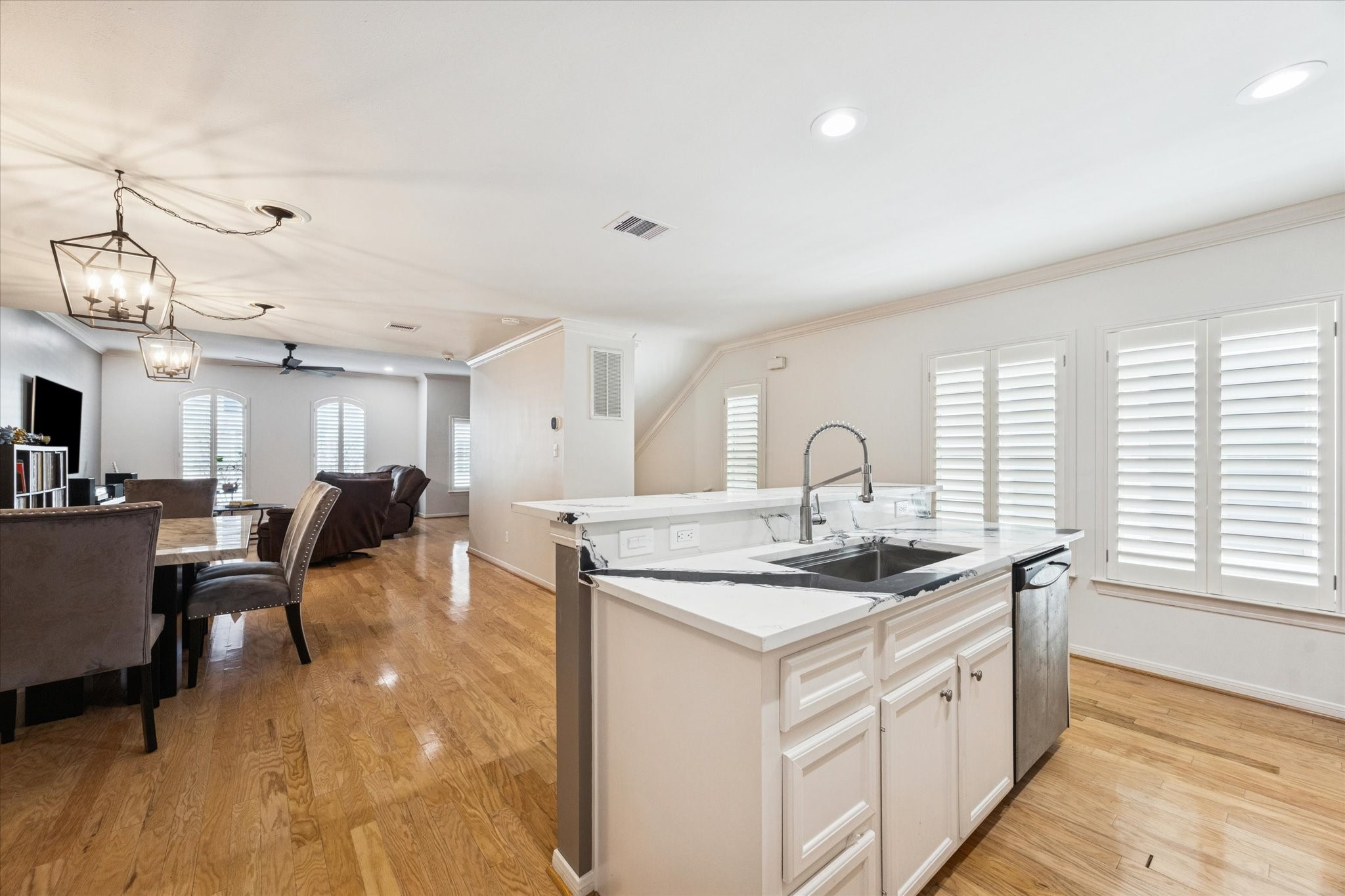 1259 West 17th Street Houston, TX 77008 - Photo 13 of 22 a kitchen with a sink cabinets and wooden floor