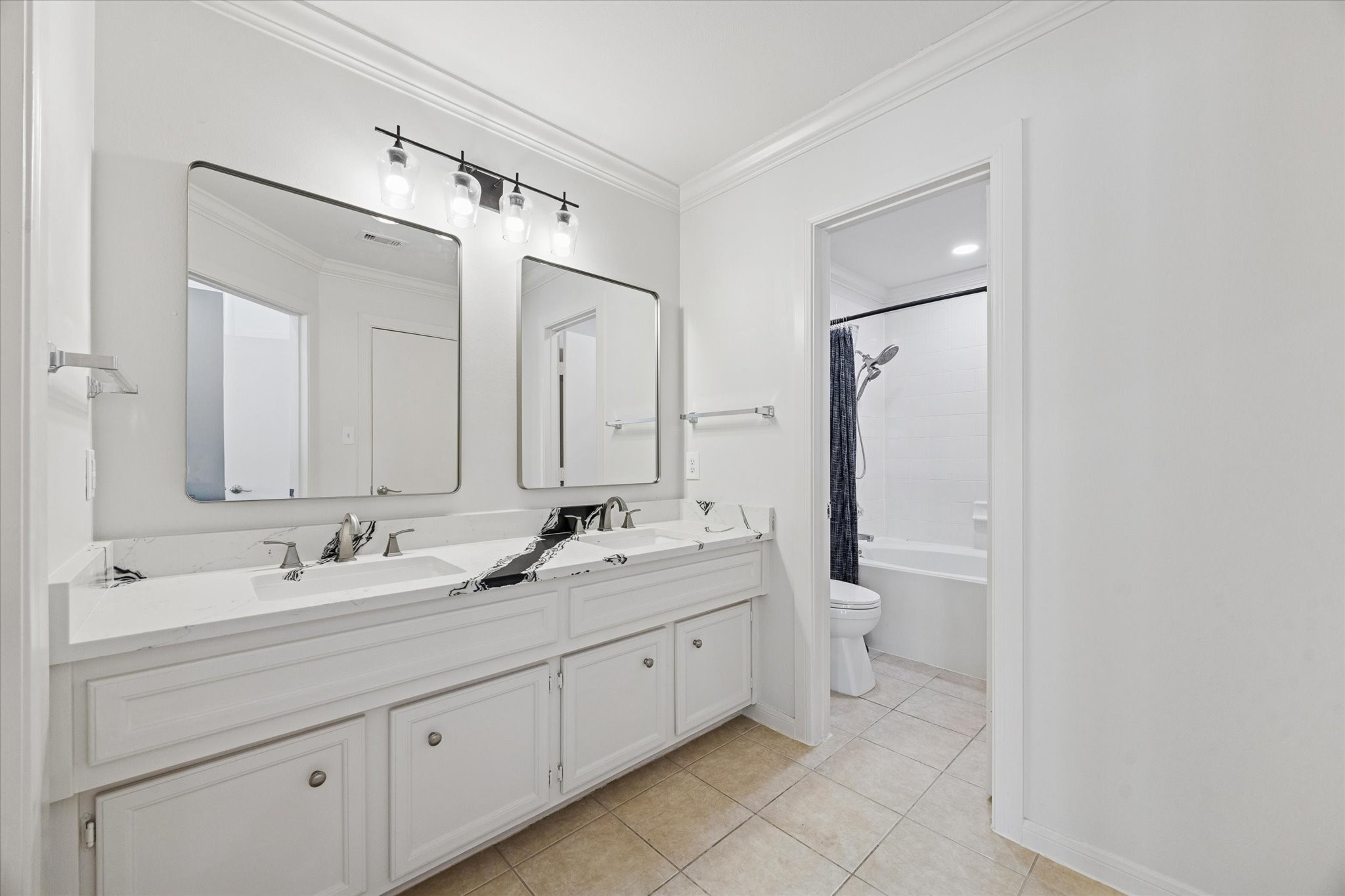 1259 West 17th Street Houston, TX 77008 - Photo 19 of 22 a bathroom with a double vanity sink mirror and toilet