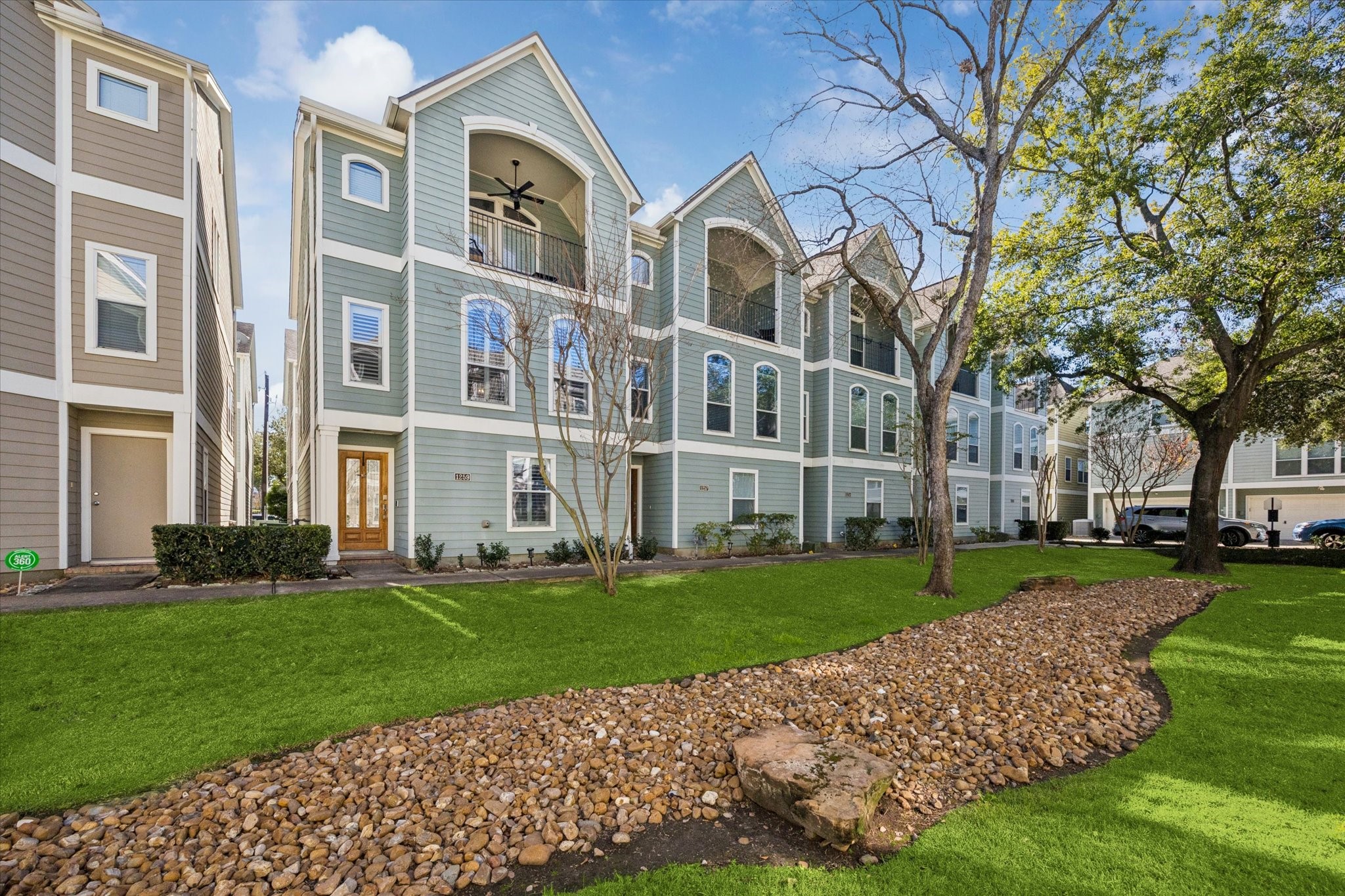 1259 West 17th Street Houston, TX 77008 - Photo 2 of 22 a front view of a building with a yard