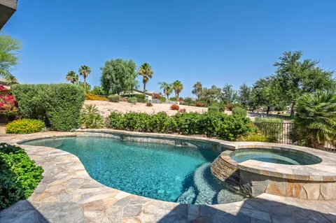 a view of a swimming pool from a lounge chair