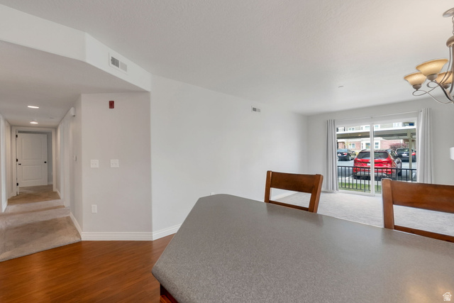117 Calbourne Lane, Unit I2 Sandy, UT 84070 - Photo 5 of 19 Kitchen, Semi Formal Dining, Hallway to bedrooms.