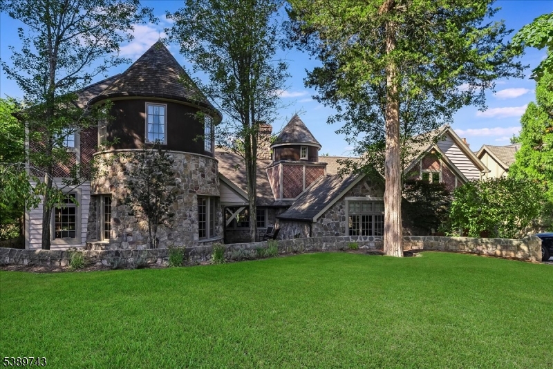 a front view of house with a garden