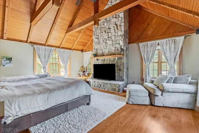 a bedroom with a bed couch and window