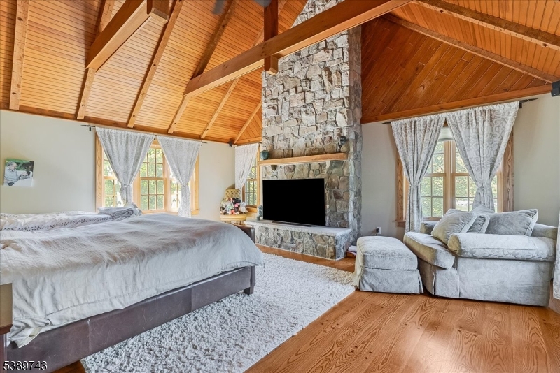 20 Island Trail Sparta, NJ 07871 - Photo 12 of 23 a bedroom with a bed couch and window