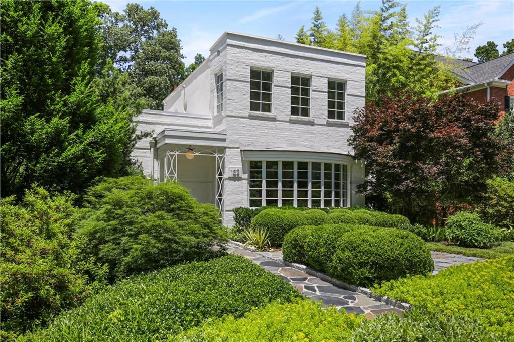 132 Beverly Road Northeast Atlanta, GA 30309 - Photo 1 of 1 front view of a house with a yard