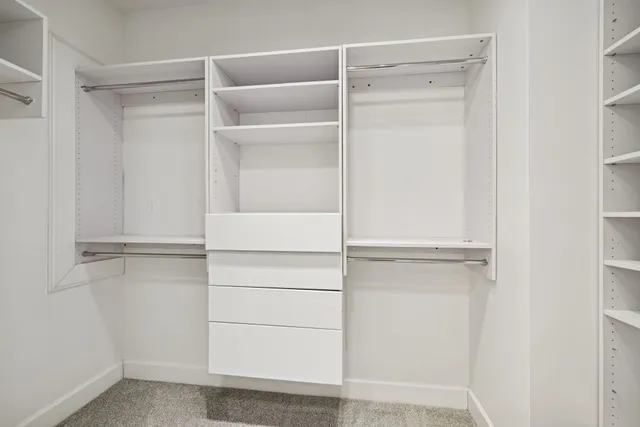 a view of an empty walk in closet