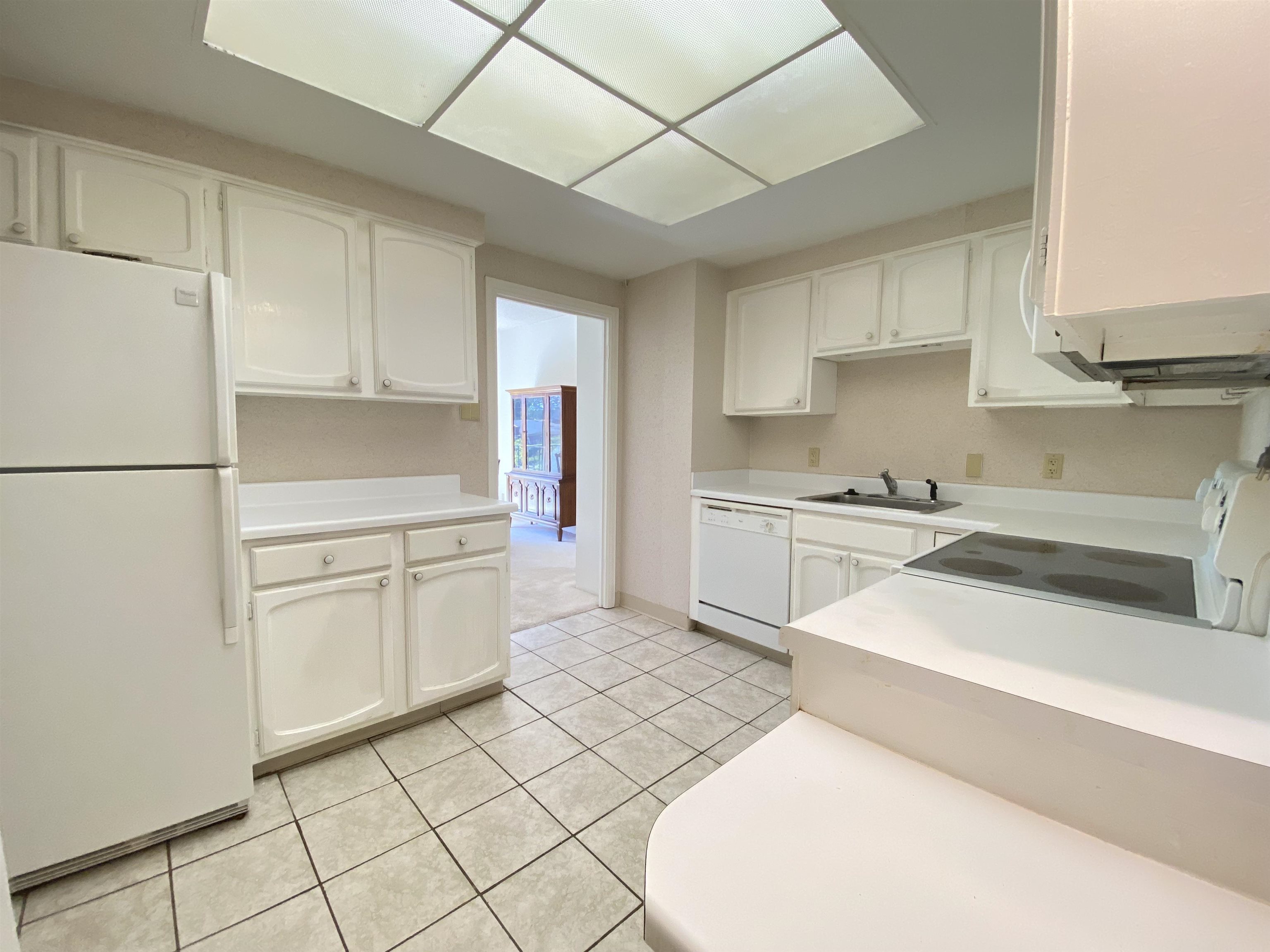475 North Highland Street, Unit 3F Memphis, TN 38122 - Photo 9 of 24 a kitchen with white cabinets and white appliances
