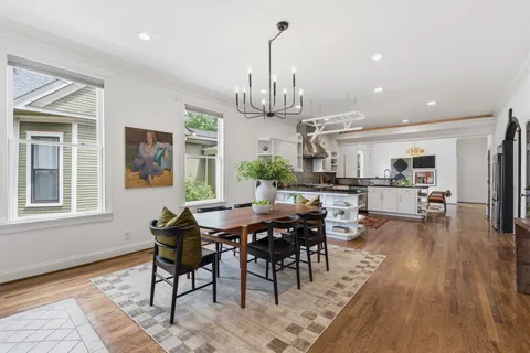 a kitchen with a sink stainless steel appliances and cabinets