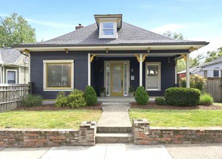 a front view of a house with garden