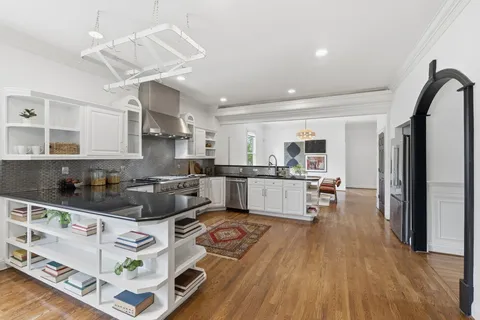 a bathroom with a sink a mirror and a shower
