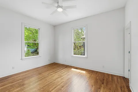 a bed room with furniture and a window