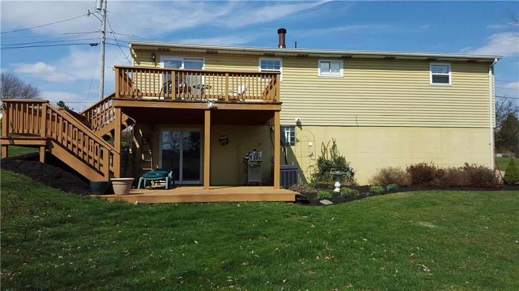 NEWLY STAINED DECK ACCESSED FROM DINING AREA WITH WOOD DECK FLOORED LOWER PATIO AREA. PRIVATE AND WOULD MAKE A GREAT AREA FOR A HOT TUB!!!