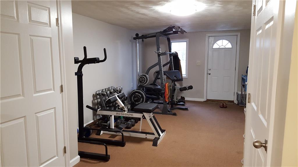 164 Jones Road Cabot, PA 16023 - Photo 17 of 23 Exercise room with man door to paved drive area