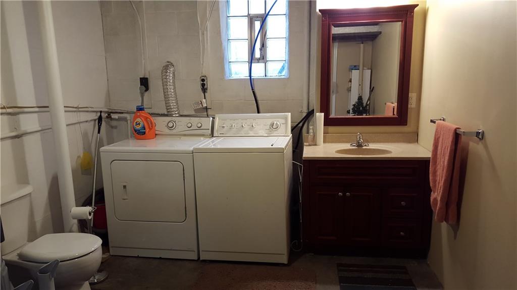 164 Jones Road Cabot, PA 16023 - Photo 18 of 23 Laundry room with new toilet and new vanity.