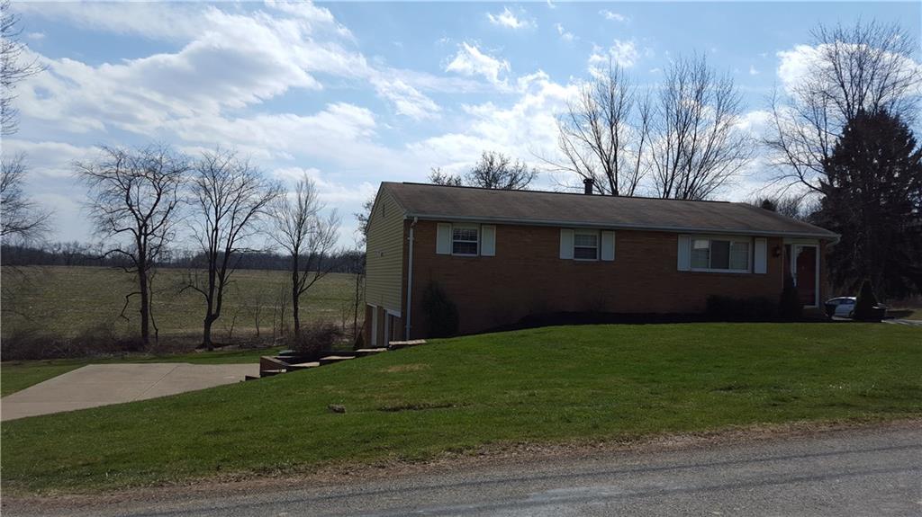 LEVEL FRONT AND REAR YARD AREAS OVERLOOKING "THE JONES FARM" FIELDS IN REAR.