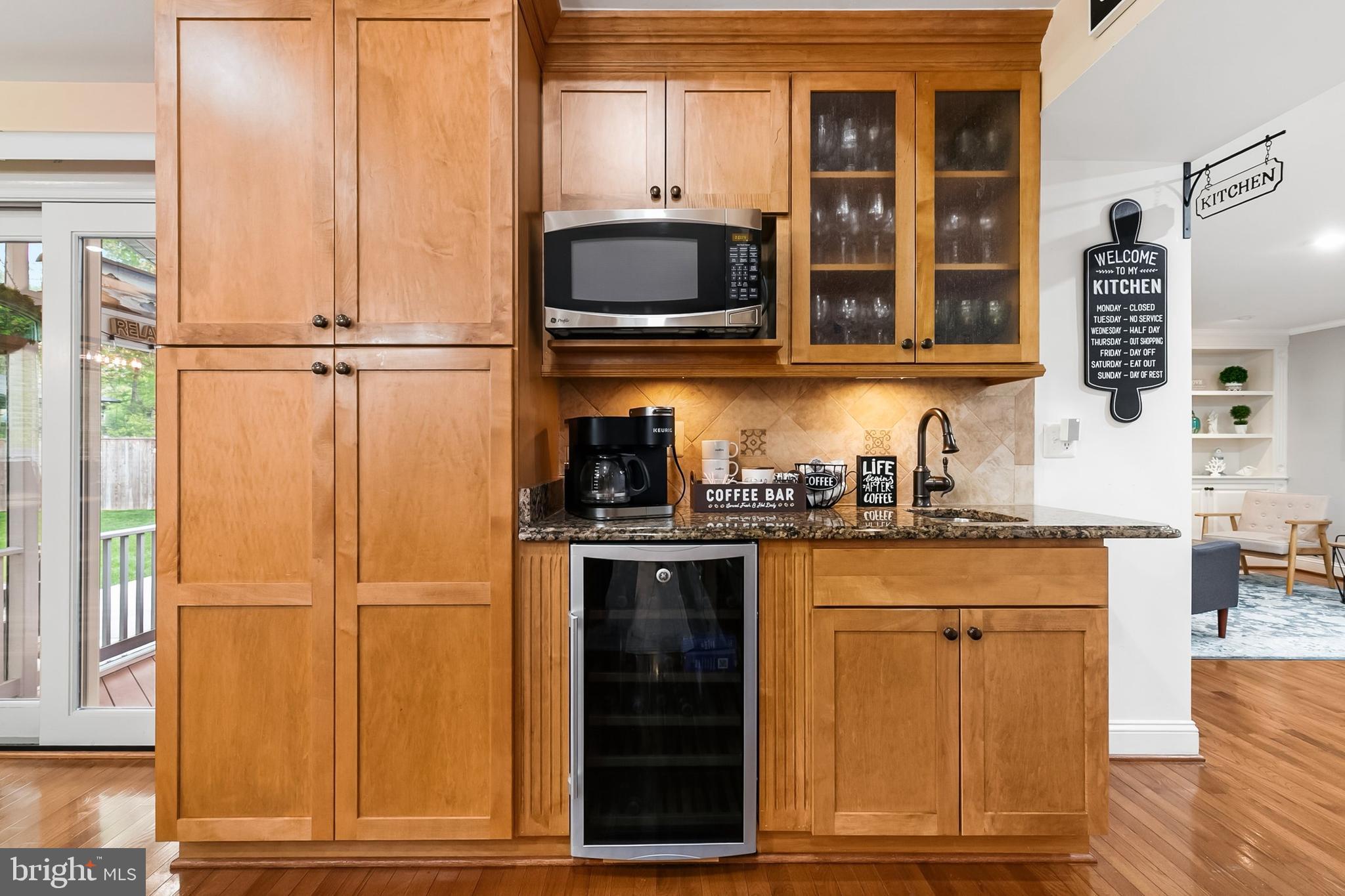 1004 Windmill Lane Silver Spring, MD 20905 - Photo 19 of 60 a kitchen with stainless steel appliances granite countertop a refrigerator and a sink