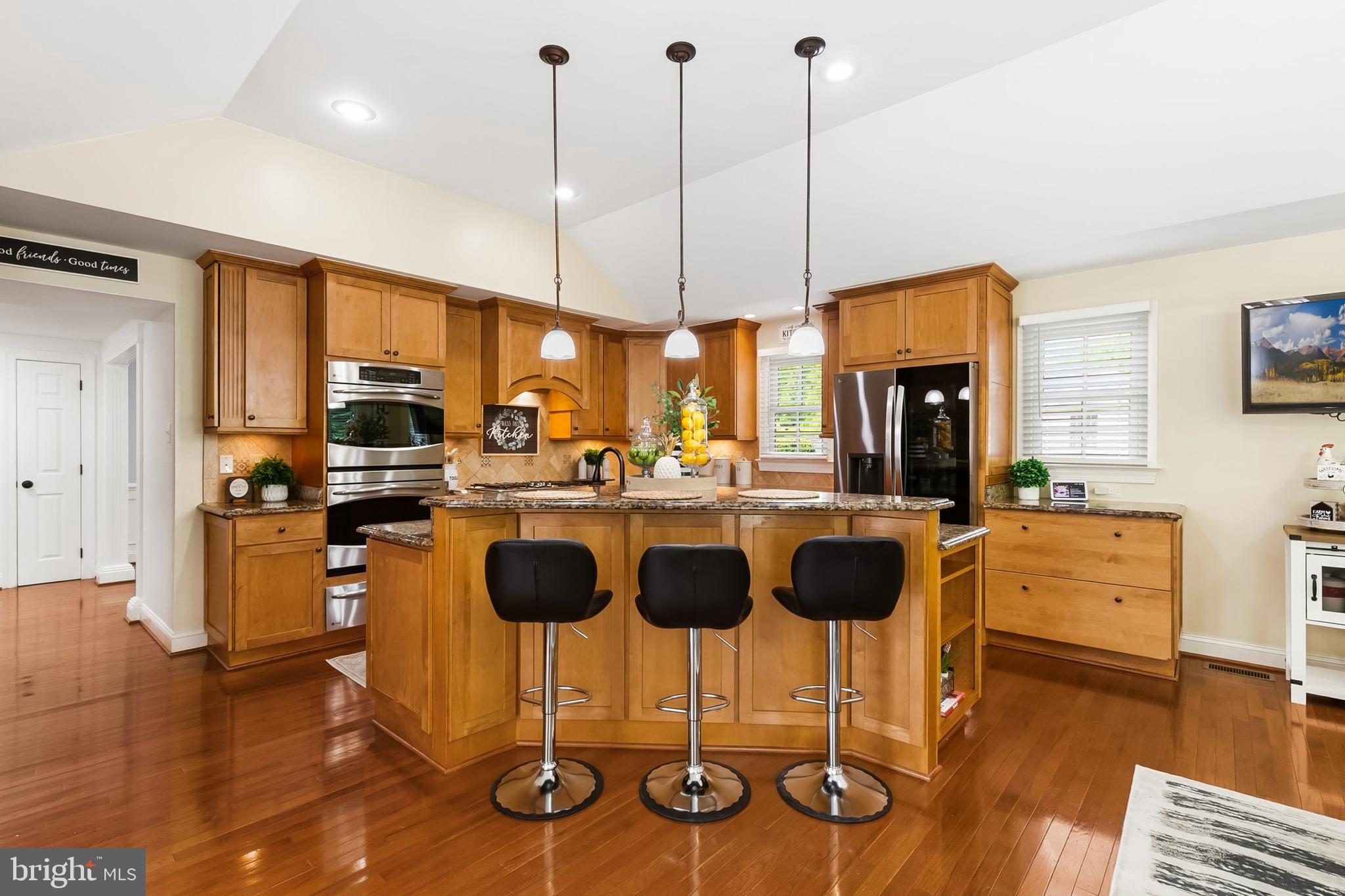 1004 Windmill Lane Silver Spring, MD 20905 - Photo 21 of 60 a kitchen with lots of counter space dining table and chairs