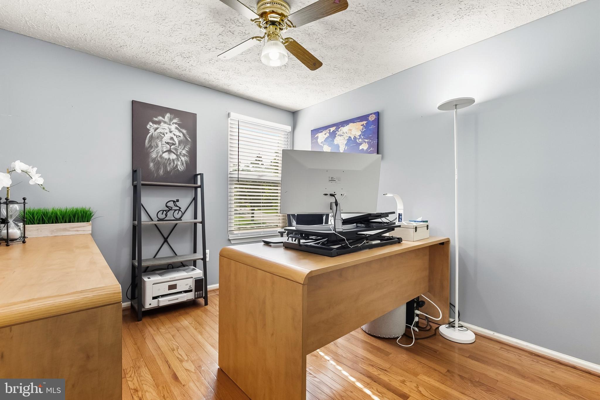 1004 Windmill Lane Silver Spring, MD 20905 - Photo 29 of 60 a room with gym equipment and wooden floor