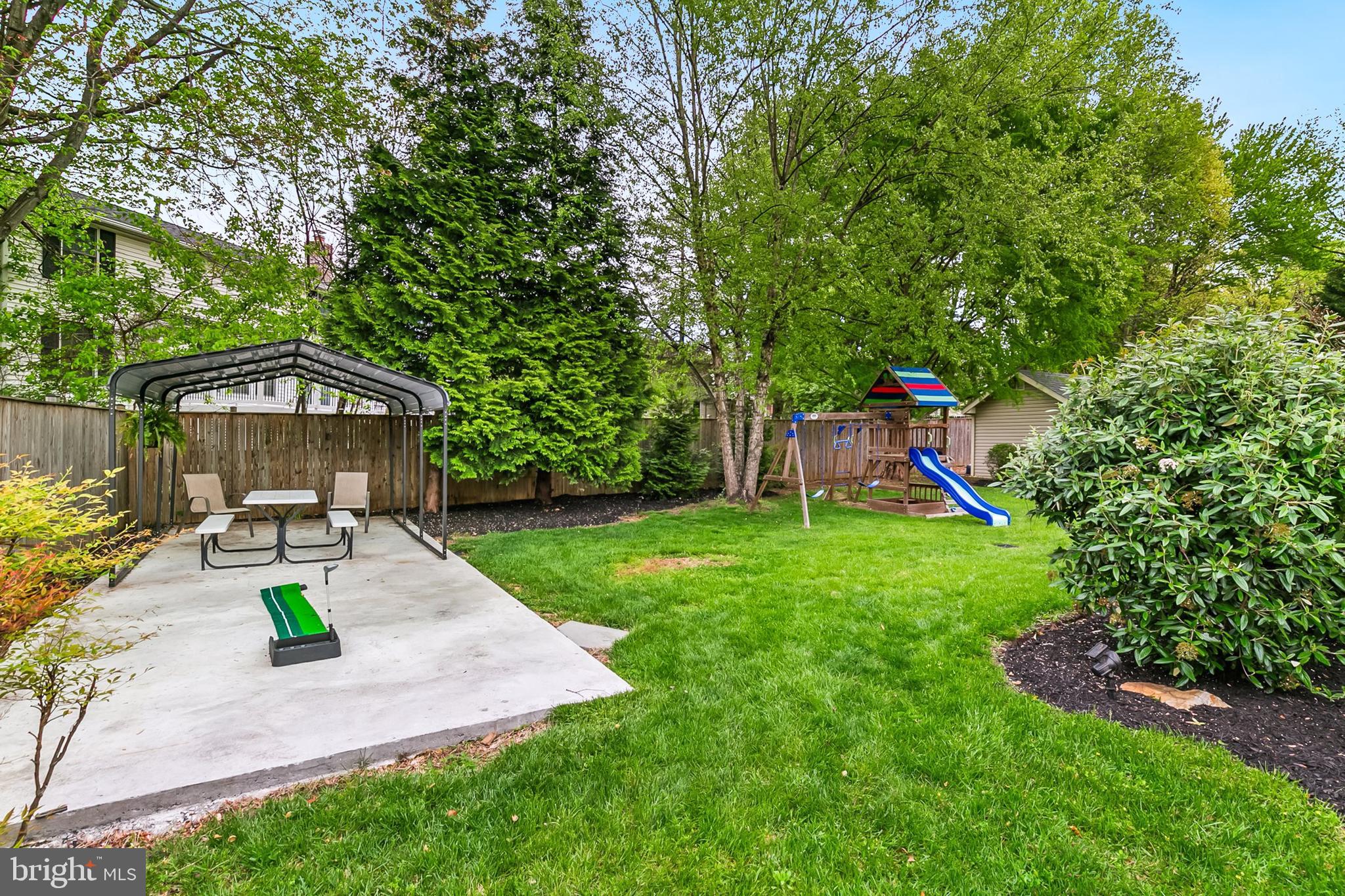 1004 Windmill Lane Silver Spring, MD 20905 - Photo 48 of 60 a front view of a house with garden and sitting area