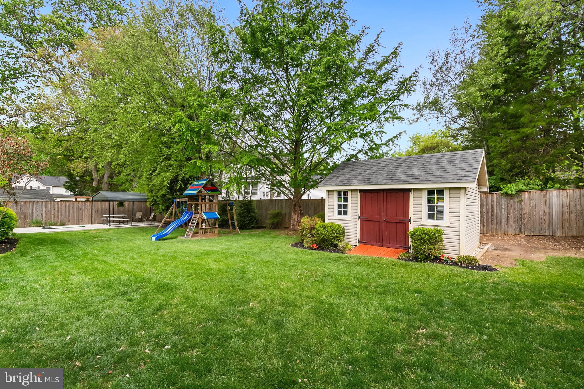 1004 Windmill Lane Silver Spring, MD 20905 - Photo 51 of 60 a view of a house with a yard and a large tree