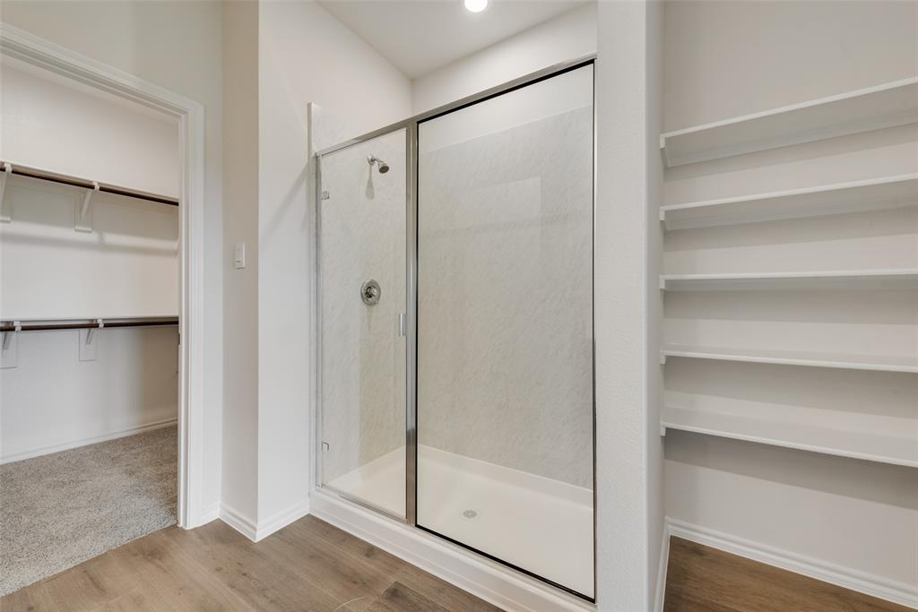 1428 Millstead Rill Drive Caddo Mills, TX 75135 - Photo 15 of 24 a bathroom with a glass shower door