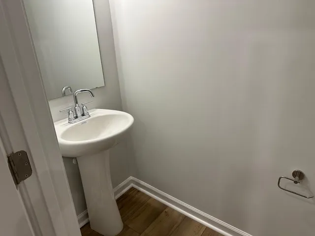 a bathroom with a sink and mirror