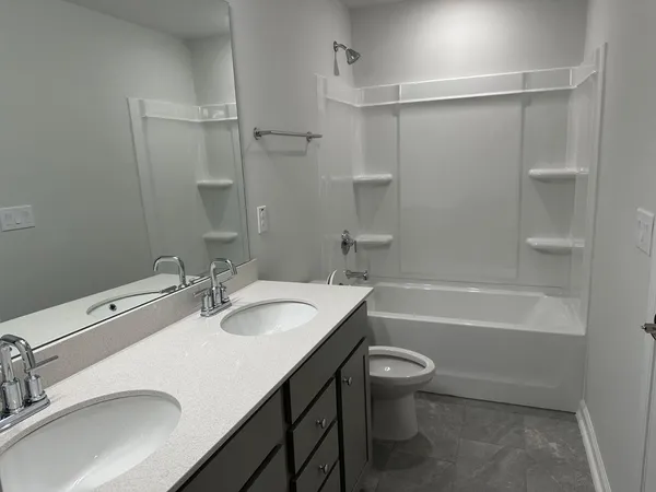 a bathroom with a sink a toilet and a bathtub