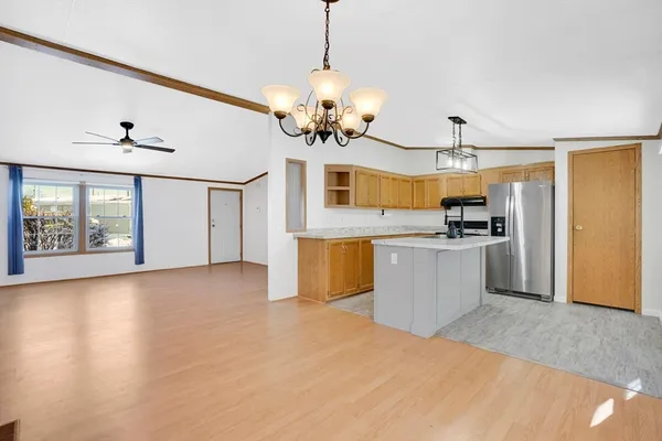 a view of a kitchen with a sink and microwave