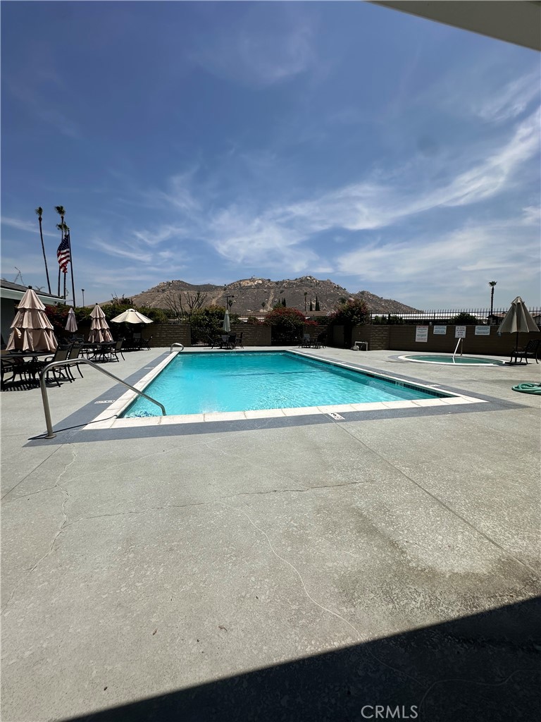 3825 Crestmore Road, Unit 414 Riverside, CA 92509 - Photo 26 of 31 a view of a terrace with a table and chairs