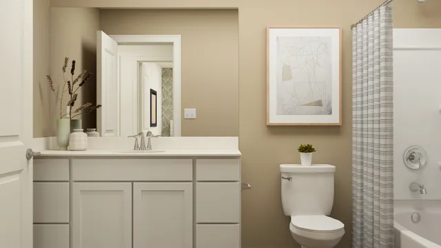 a bathroom with a sink toilet and mirror