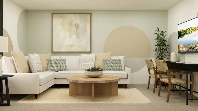 a living room with furniture and a potted plant