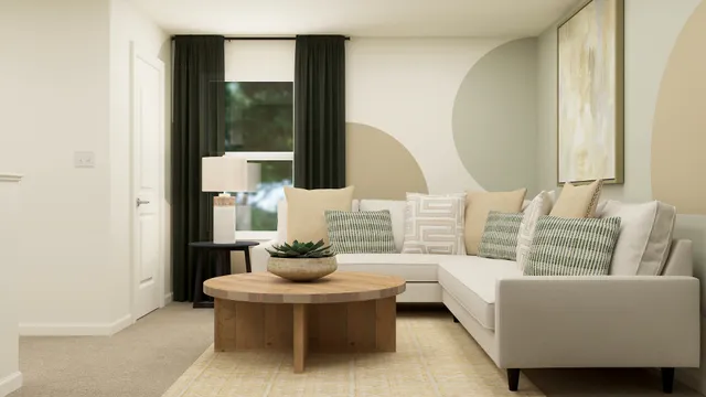 a living room with furniture and a potted plant