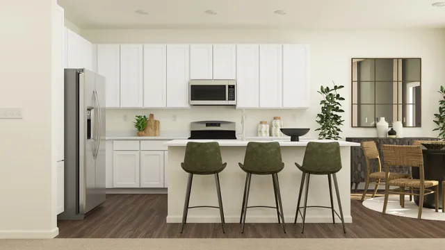 a kitchen with stainless steel appliances a stove a refrigerator and cabinets