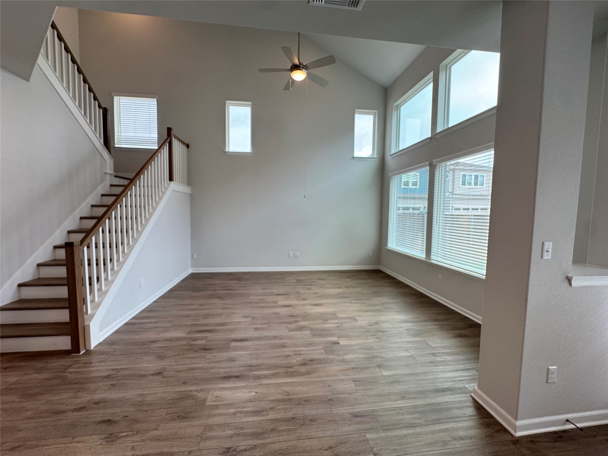 3000 Chisholm Trail Road, Unit 103 Round Rock, TX 78681 - Photo 10 of 32 living room featuring ceiling fan, dark wood-type flooring, and lofted ceiling