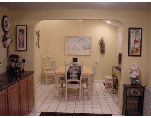 7 Argonne Road Billerica, MA 01821 - Photo 11 of 16 a living room with furniture a flat screen tv and a table