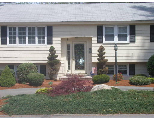7 Argonne Road Billerica, MA 01821 - Photo 3 of 16 a front view of a house with garden