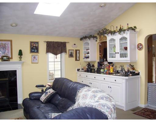 7 Argonne Road Billerica, MA 01821 - Photo 6 of 16 a living room with furniture and a fireplace