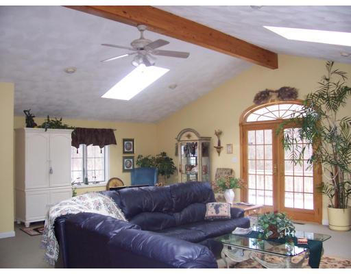 7 Argonne Road Billerica, MA 01821 - Photo 7 of 16 a living room with furniture and a large window