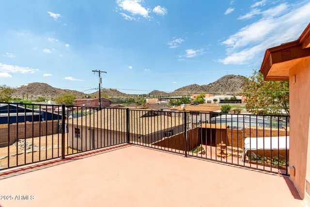 a kitchen with a sink a stove and cabinets