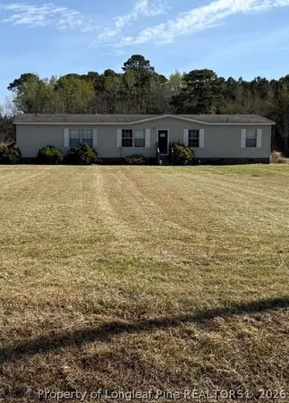 a view of house with outdoor space
