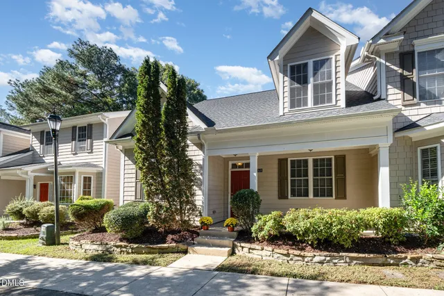a balcony with furniture and potted plants