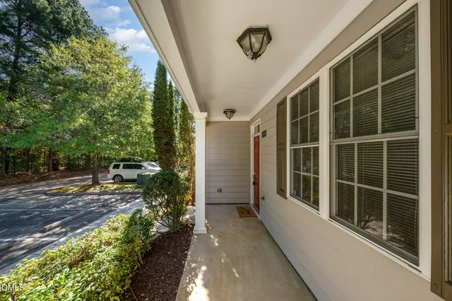 a front view of a house with outdoor seating