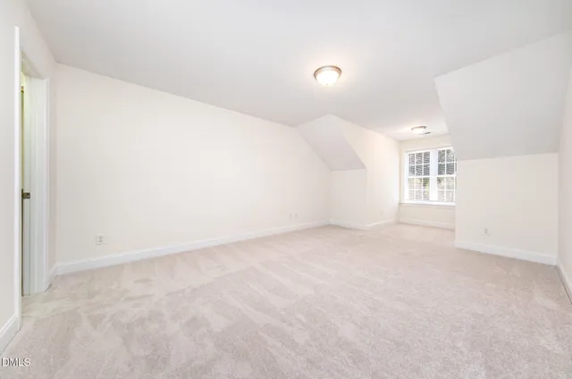 a view of a room with a kitchen