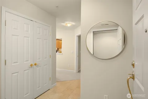a bathroom with a granite countertop shower a mirror and a shower