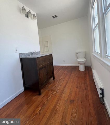 a bathroom with a sink and a shower