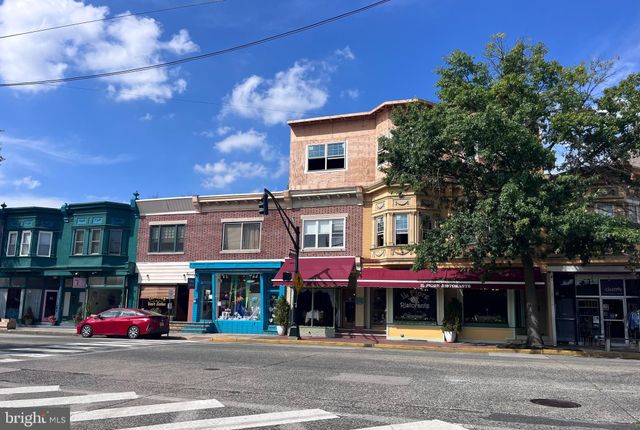 a front view of a building with street view